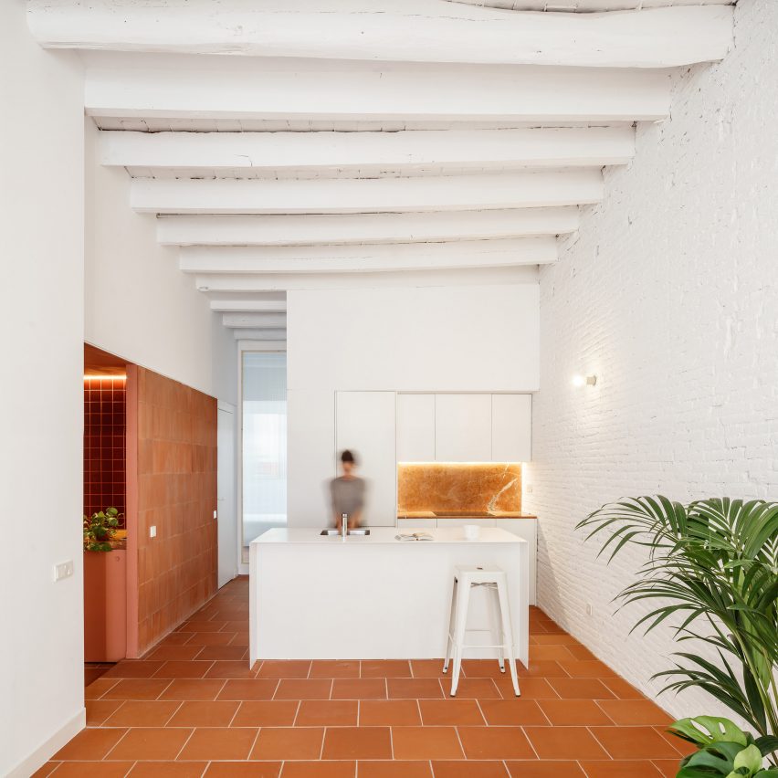 CRÜ combines different terracotta textures in Barcelona apartment