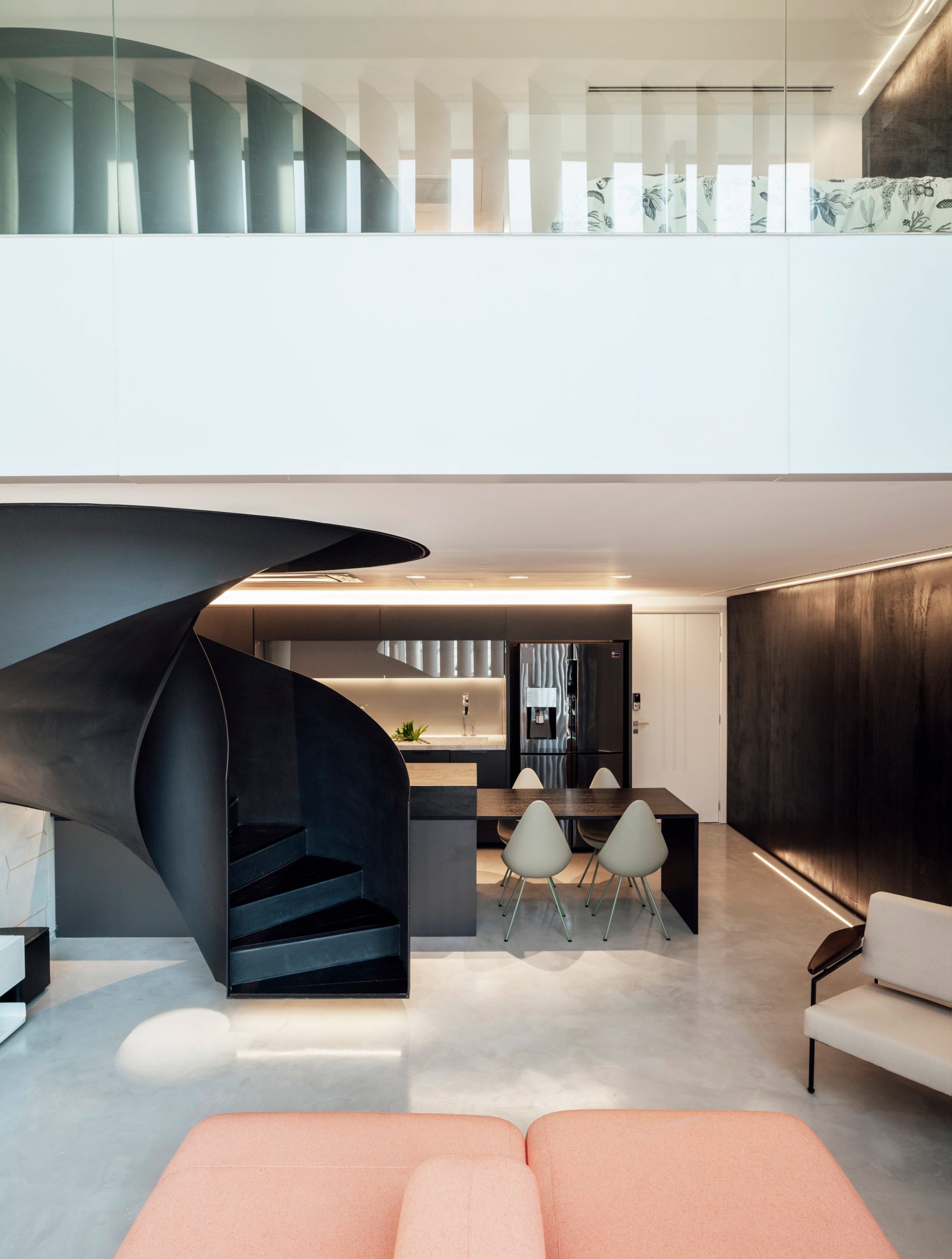 Sculptural staircase forms centrepiece of Loft Diego in Porto Alegre