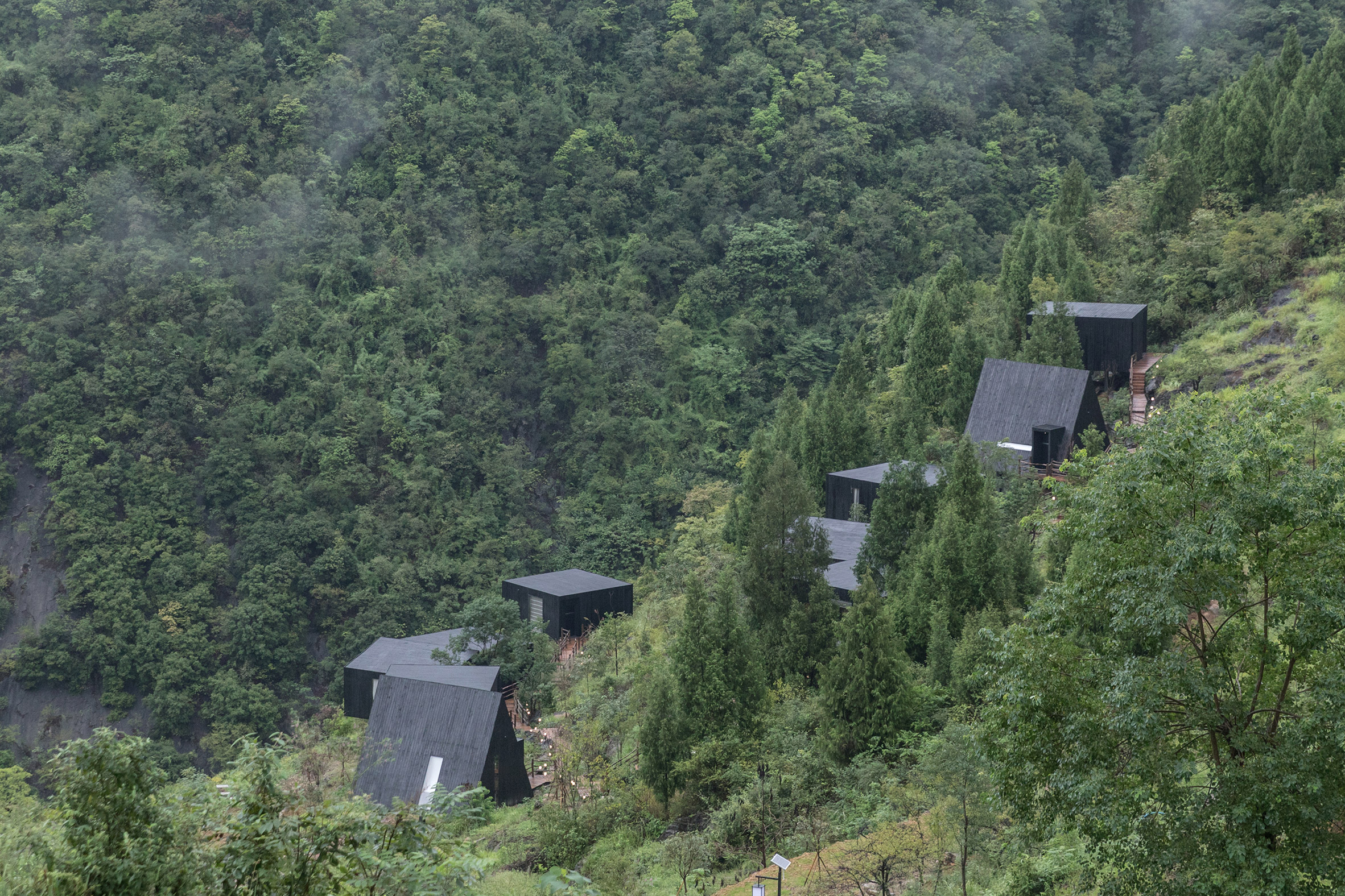 The Mushroom by ZJJZ is a cone-shaped guest house in the woods of Jiangxi,  China