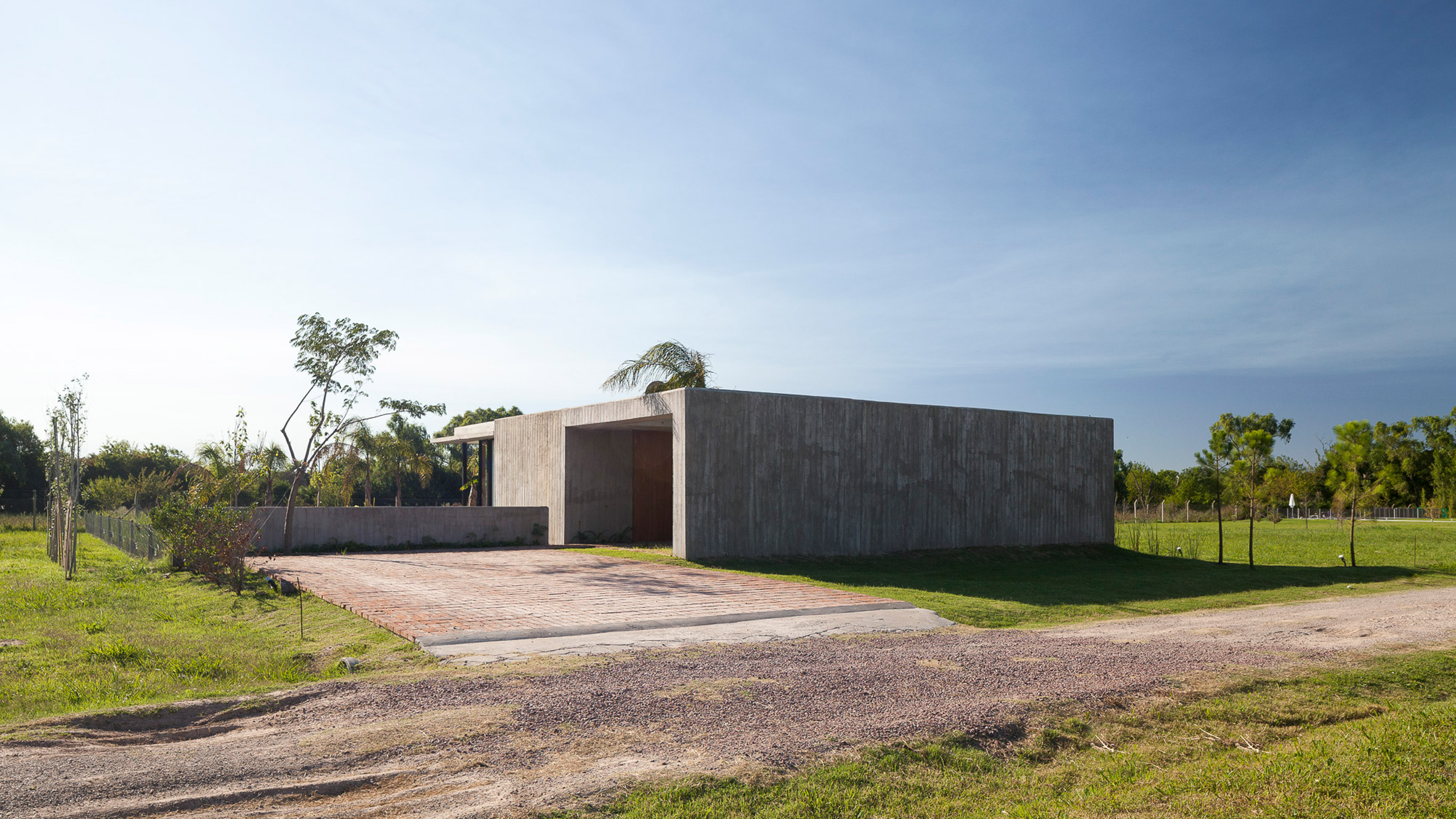 Board marked concrete hides patio in Casa Closed by Gonzalez Arzac