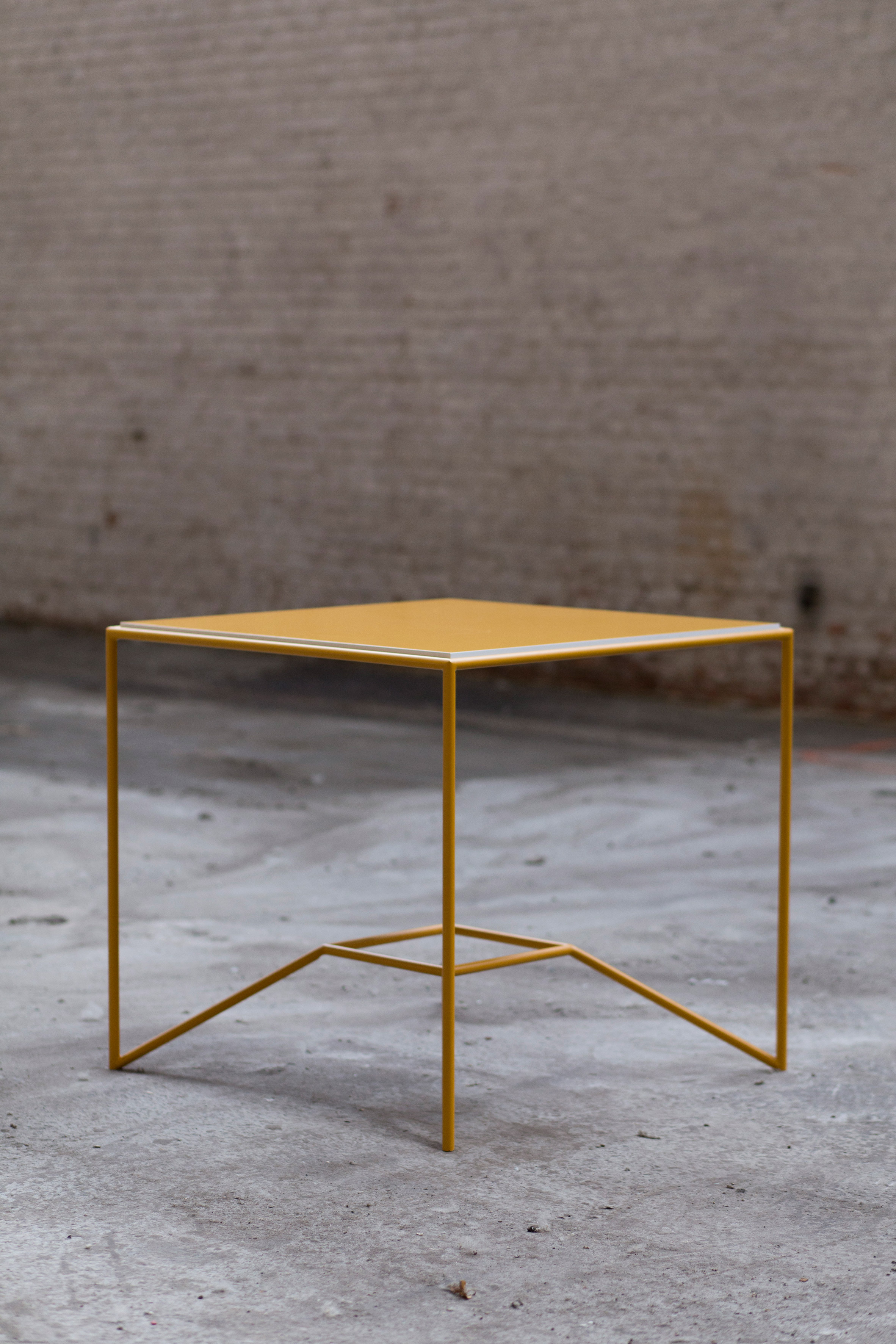 Maria Scarpulla's tables with flippable tops are designed to suit your mood