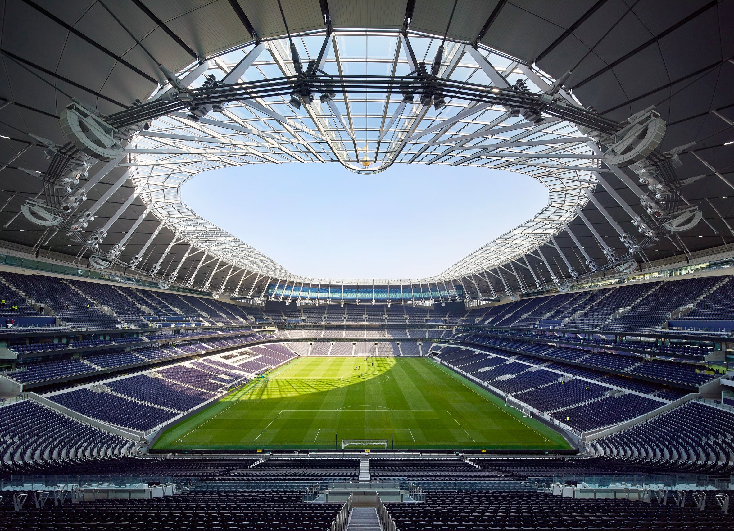  An empty Tottenham Hotspur stadium with a closed roof.