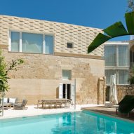 AP Valletta adds extension with "woven" stone facade to The Coach House in Malta