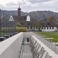 MLZD adds subterranean sports hall to school in a former monastery