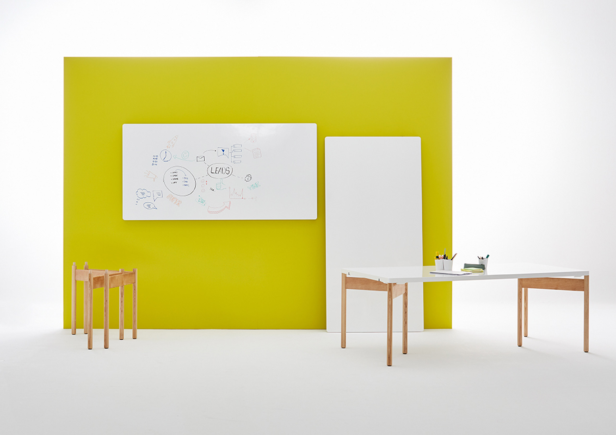 Moving Walls' latest office table doubles up as a wall writing panel