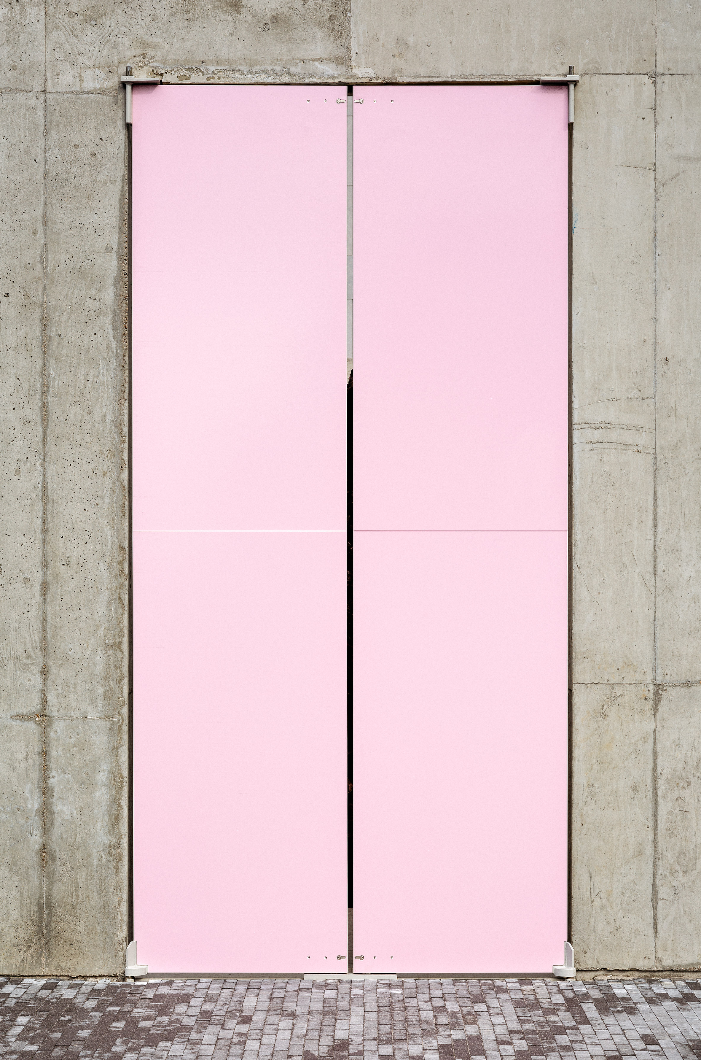 Five concrete boxes with doors form Antwerp's Laere Gallery