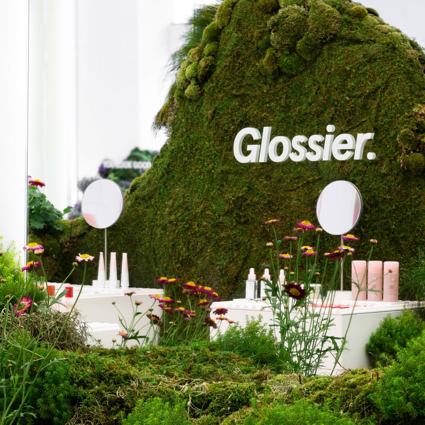 Glossier pop-up shop in Seattle features rolling hills covered in moss and flowers