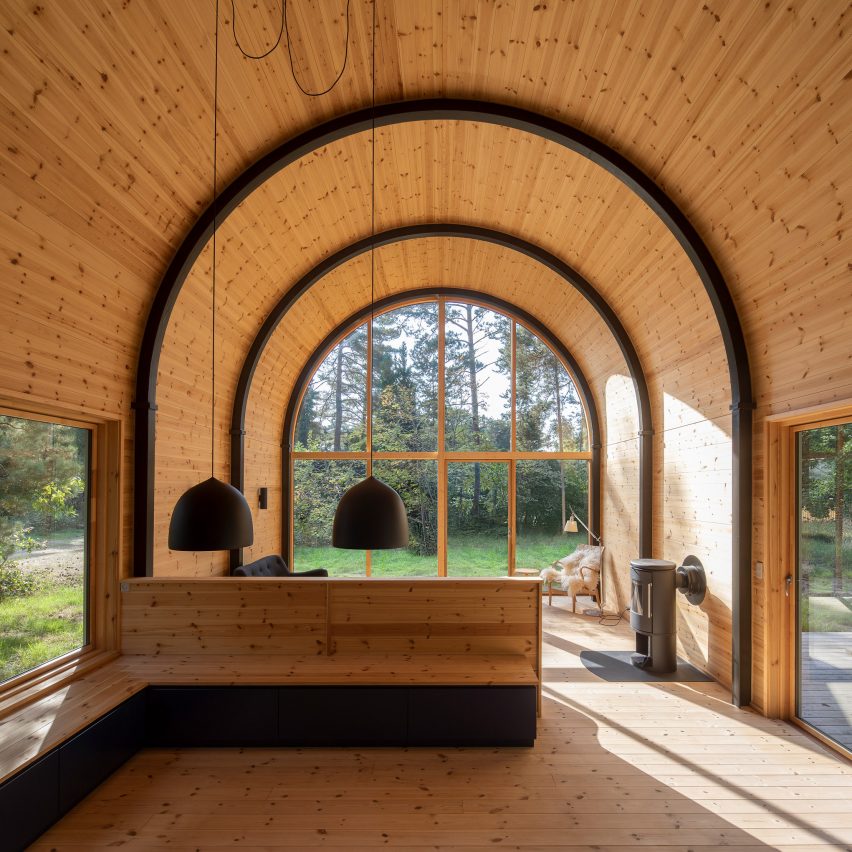 Valbæk Brørup Architects designs barrel-vaulted cabin in Danish forest