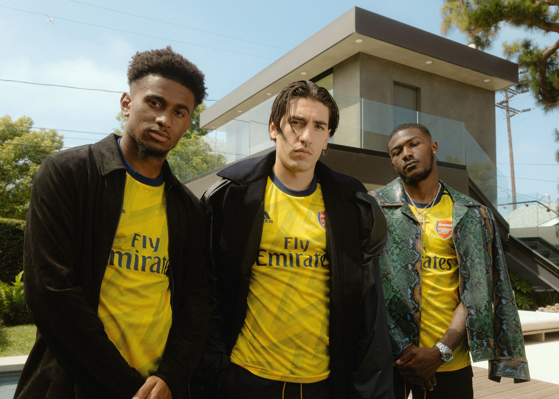 Modern Arsenal players in the 'bruised banana' Adidas kit will
