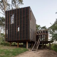 Wood stripes detail black house in rural Uruguay by FRAM Arquitectos and Delfina Riverti