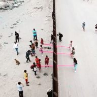 Rael San Fratello slots pink seesaws into US-Mexico border wall