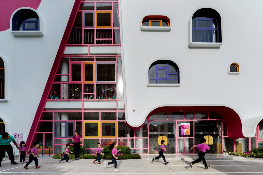 TTC Elite Saigon Kindergarten in by Kientruc O in has a distinctive facade decorated with colourful patches and irregularly shaped windows.