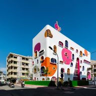 TTC Elite Saigon Kindergarten in by Kientruc O in has a distinctive facade decorated with colourful patches and irregularly shaped windows.