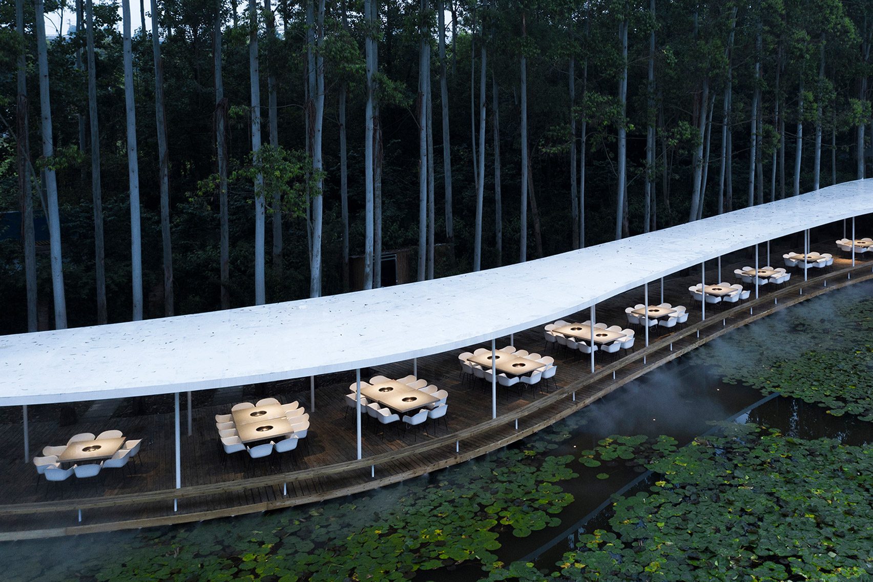 Snaking canopy covers open-air hotpot restaurant in Chinese forest