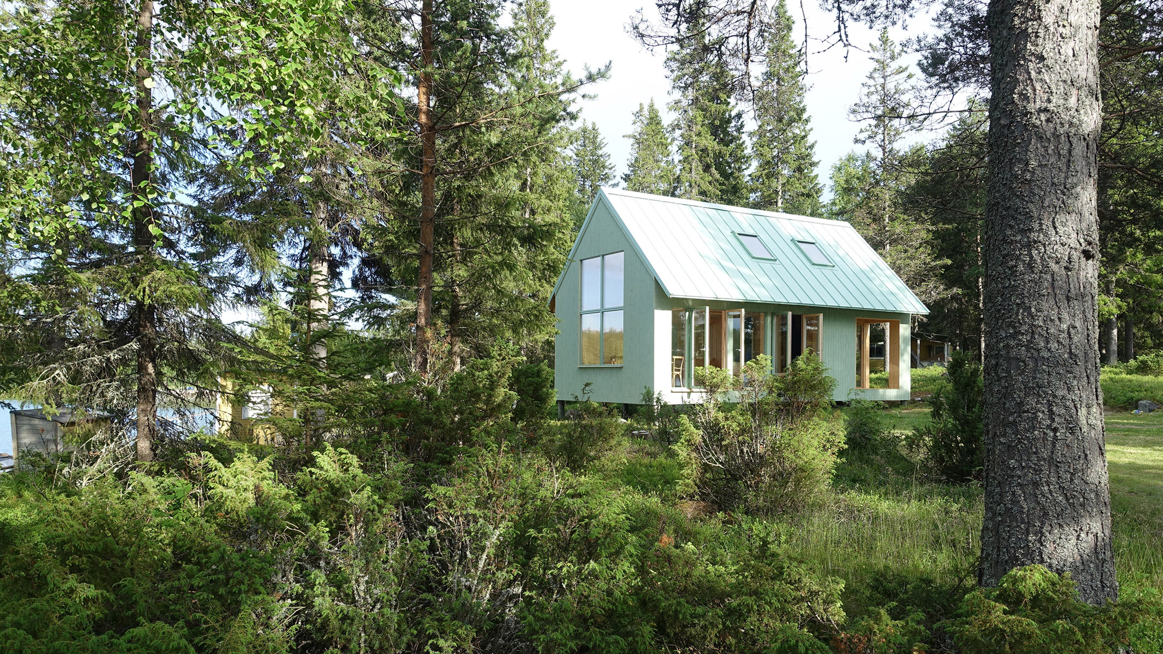 Bornstein Lyckefors builds pale green cabin on rural Swedish island