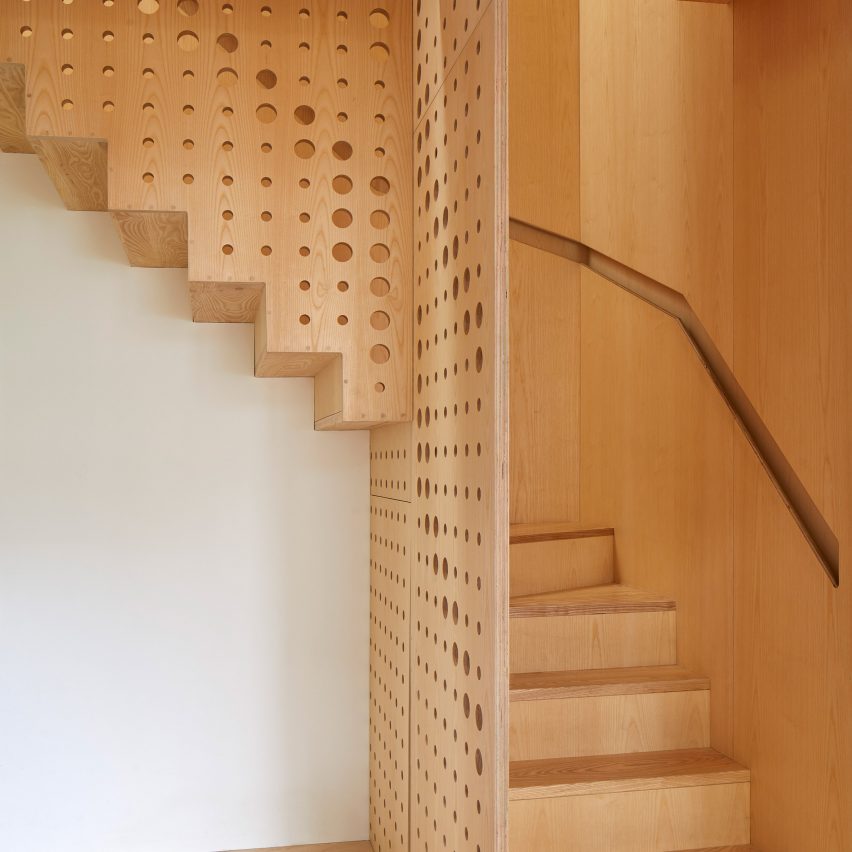 R2 Studio adds hole-punched staircase made of ash wood to London house