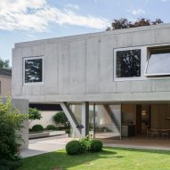Raw concrete house in Bavaria cantilevers over outdoor terrace