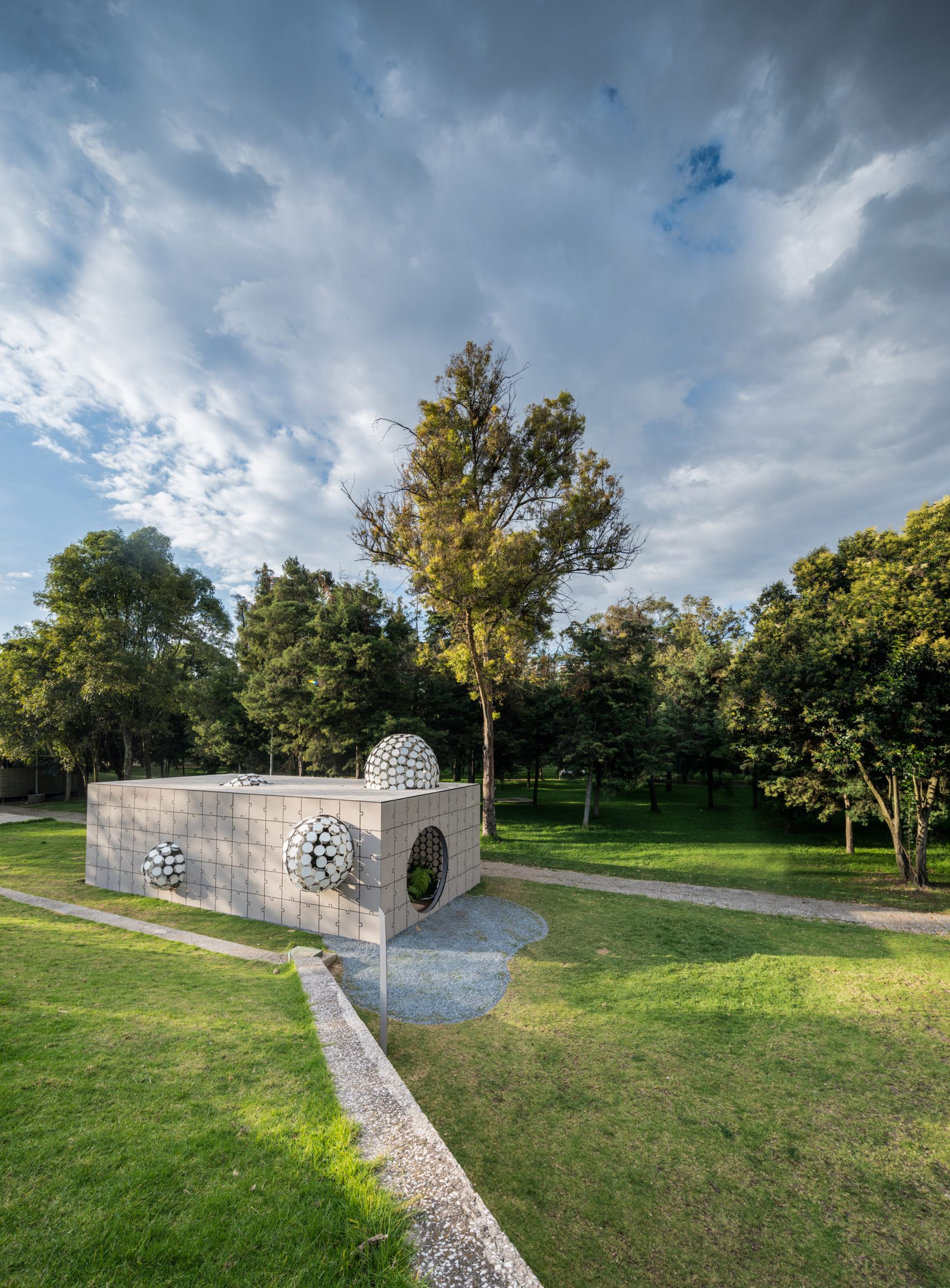 Bubbles protrude from concrete puzzle pavilion at Design Week Mexico ...