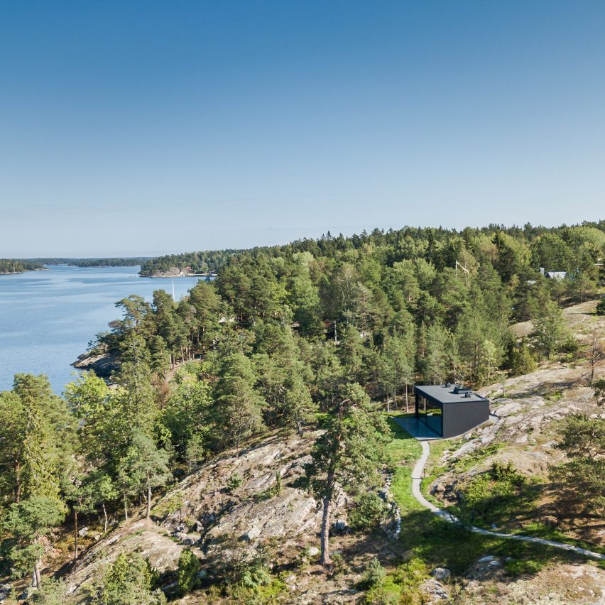 All-black sauna embedded in Stockholm's rocky island frames sea views