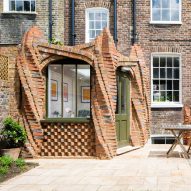 Twisting brick columns support London terrace extension by Urban Mesh