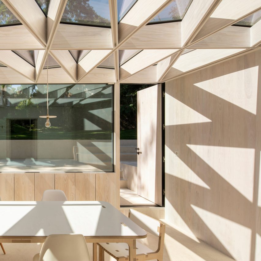 Faceted roof casts zigzagging shadows over London house extension