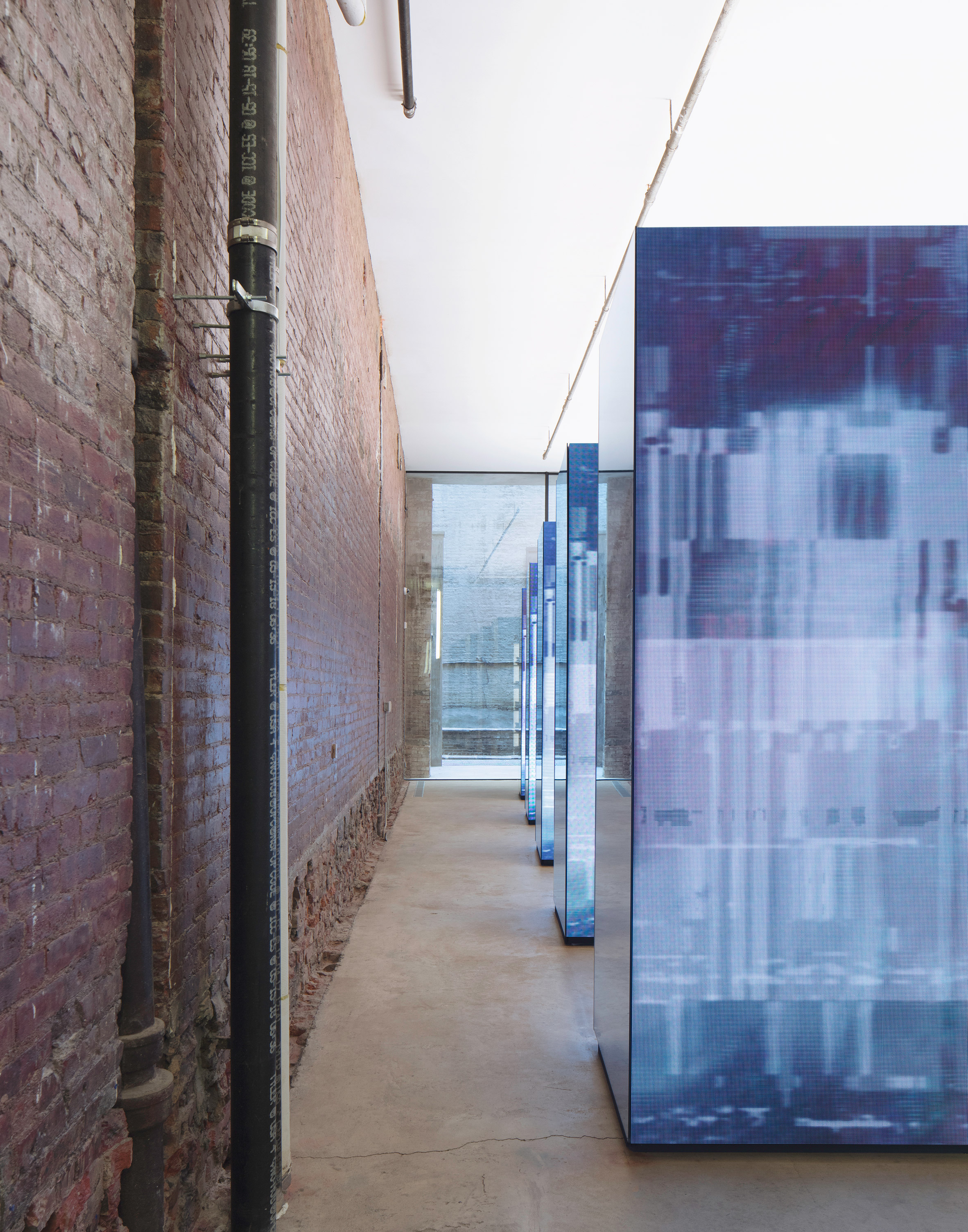 Leong Leong adds monolithic screens to R13 s brickwork flagship store