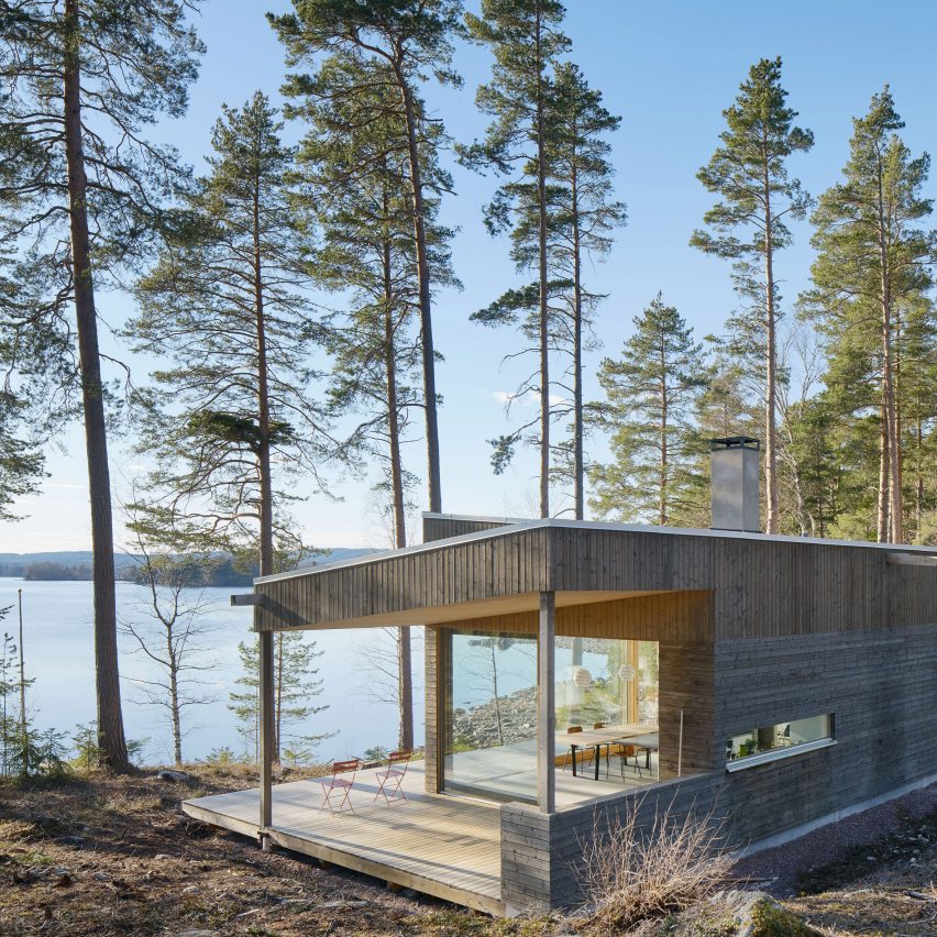 Lakeside house in Sweden is clad with birch slats to match the forest