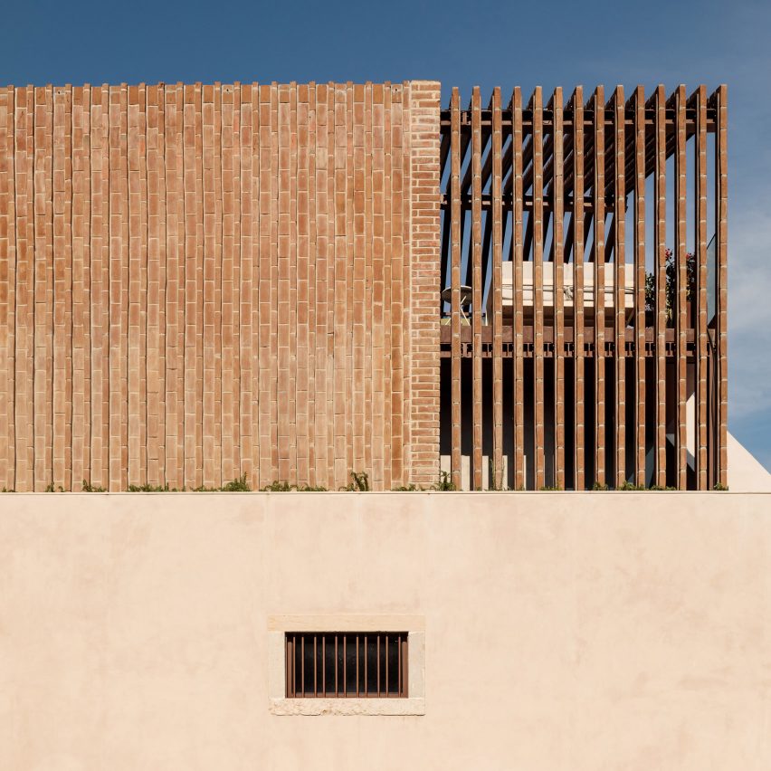 António Costa Lima inserts brick home into an old Lisbon warehouse