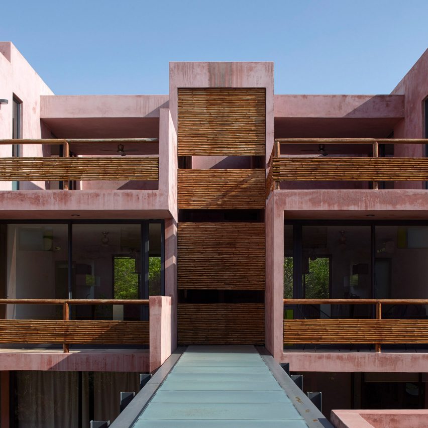 Pink Tulum residences surround central courtyard and pool