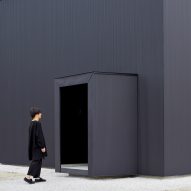 Atelier Kento Eto designs minimal black house hiding lofty interiors