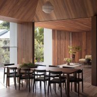 Timber walls pivot to open holiday home to the outdoors in Australia