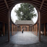 Curving glass walls bulge into courtyards of converted Beijing hutong