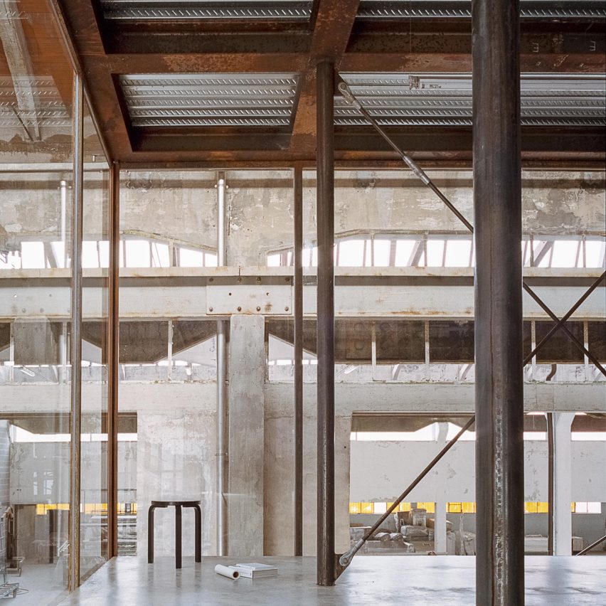 AMAA creates own studio by inserting huge glass box inside old Italian factory