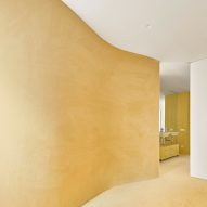 Arquitectura-G completes sunshine-yellow Barcelona apartment for "nuclear family"