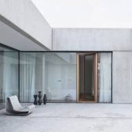 Concrete home in Slovenia combines living spaces with a ceramics studio