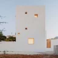 Architect designs own house with white tower in Puglia