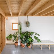 Escribano Rosique Arquitectos use white bricks and timber for house in Spain