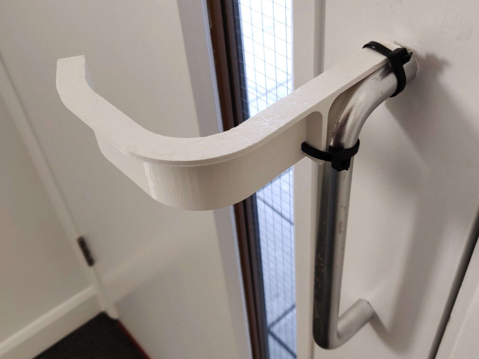 Hands-free door handle adaptor by Ivo Tedbury and Freddie Hong