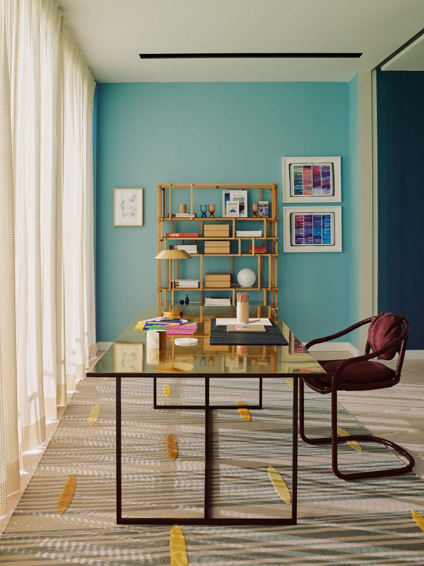Gold desk in turquoise room