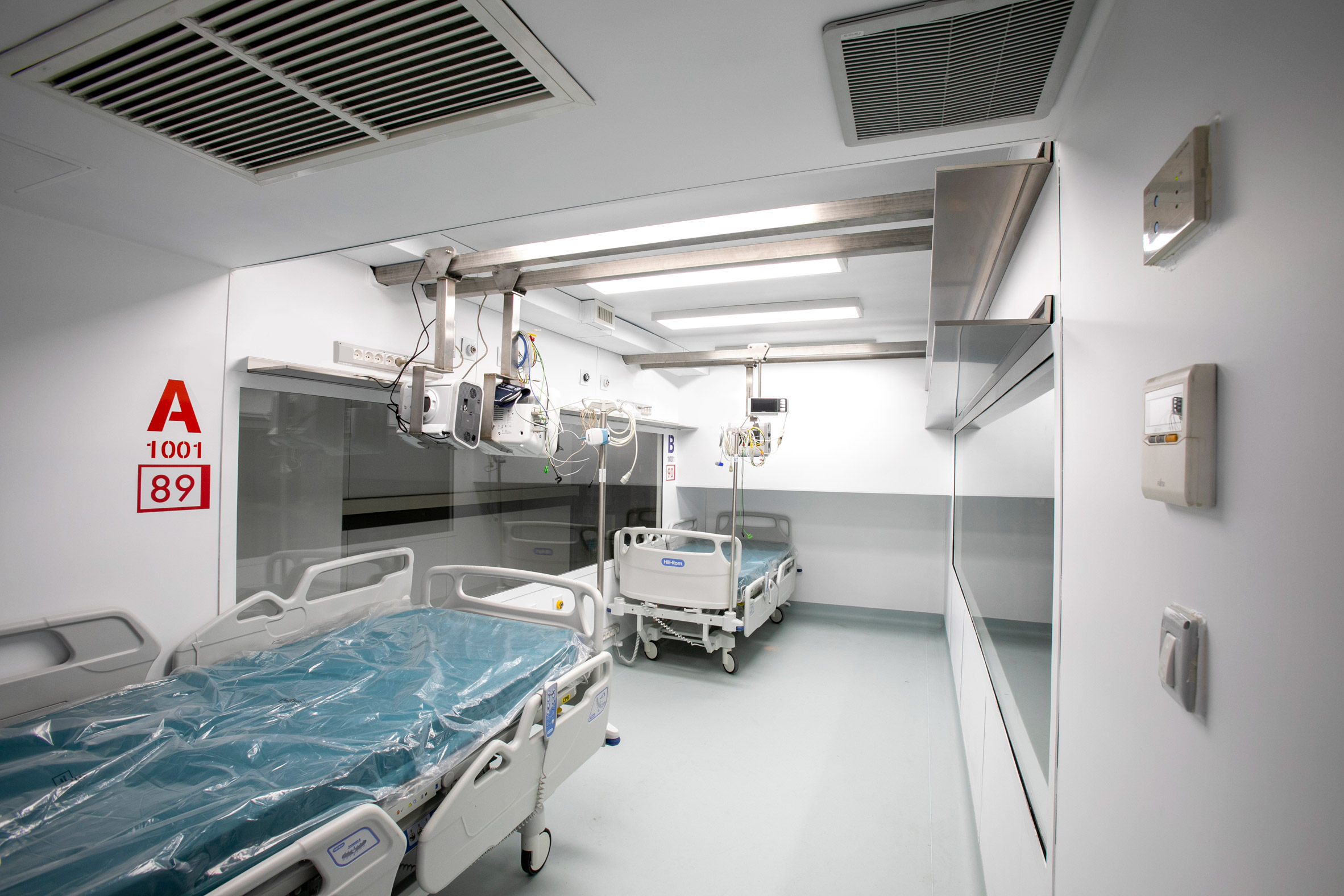 A two-bed intensive care unit within a shipping container, designed by Italian architects Carlo Ratti and Italo Rota, has been built at a hospital in Turin and is being used to treat patients fighting the coronavirus. Named Connected Units for Respiratory Ailments – or CURA, which is the latin word for cure – the intensive care pod was installed to increase intensive care unit (ICU) capacity in northern Italy. Designed by Ratti and Rota to treat two patients requiring intensive care, the unit has been installed at a temporary hospital built within the Officine Grandi Riparazioni complex in central Turin. The first patient was admitted earlier this week on 19 April.   Connected Units for Respiratory Ailments (CURA) intensive care  shipping-container pod by Carlo Ratti and Italo Rota   Built within a 6.1-metre-long shipping container, the intensive care pod contains two beds along with ventilators, monitors, intravenous fluid stands and syringe drivers. According to Ratti the pods combine the benefits of tents with permanent isolation wards as it has a ventilation system that generates negative pressure – a common technique used in hospitals to prevent contaminated air from escaping. The designers say the unit has been designed to comply with Airborne Infection Isolation Rooms (AIIRs) standards. "CURA strives to be as fast to be mounted as a hospital tent, but as safe as a regular isolation ward to work in, thanks to the comprehensive biocontainment equipment," said the designers.   The pod  It is extractor creates indoor negative pressure to comply with the standards of Airborne Infection Isolation Rooms. Two glass windows carved on the opposite sides of the containers are meant for doctors to always get a sense of the status of patients both inside and outside the pods. Also, this would potentially allow external visitors to get closer to their relatives in a safer and more humane setting.   "CURA aims to improve the efficiency of the existing design solutions of field hospitals, producing a compact ICU pod that is quick-to-deploy and safe to work in for medical professionals." The pod in Turin is the first CURA pod to be built, but further units are already under construction in other parts of the world including the UAE and Canada. CURA has been developed as an open-source project, with its tech specs, drawings and design materials made accessible for everyone online on https://curapods.org/open-source-files.   The pods are designed to work as single units, as the one in Turin is set up, or combined to create larger field hospitals.   Photography is by Max Tomasinelli. Project credits: Design and innovation: CRA-Carlo Ratti Associati with Italo Rota Medical engineering: Humanitas Research Hospital Medical consultancy: Policlinico di Milano Master planning, design, construction and logistics support services: Jacobs Research: MIT Senseable City Lab Visual identity & graphic design: Studio FM milano Digital media: Squint/Opera Safety and certifications: IEC Engineering Logistics: Alex Neame of Team Rubicon UK MEP engineering: Ivan Pavanello of Projema Medical consultancy: Maurizio Lanfranco of Ospedale Cottolengo Medical equipment supply: Philips Painting products: Gruppo Boero Support: World Economic Forum Covid-19 Action Platform, and Cities, Infrastructure and Urban Services Platform