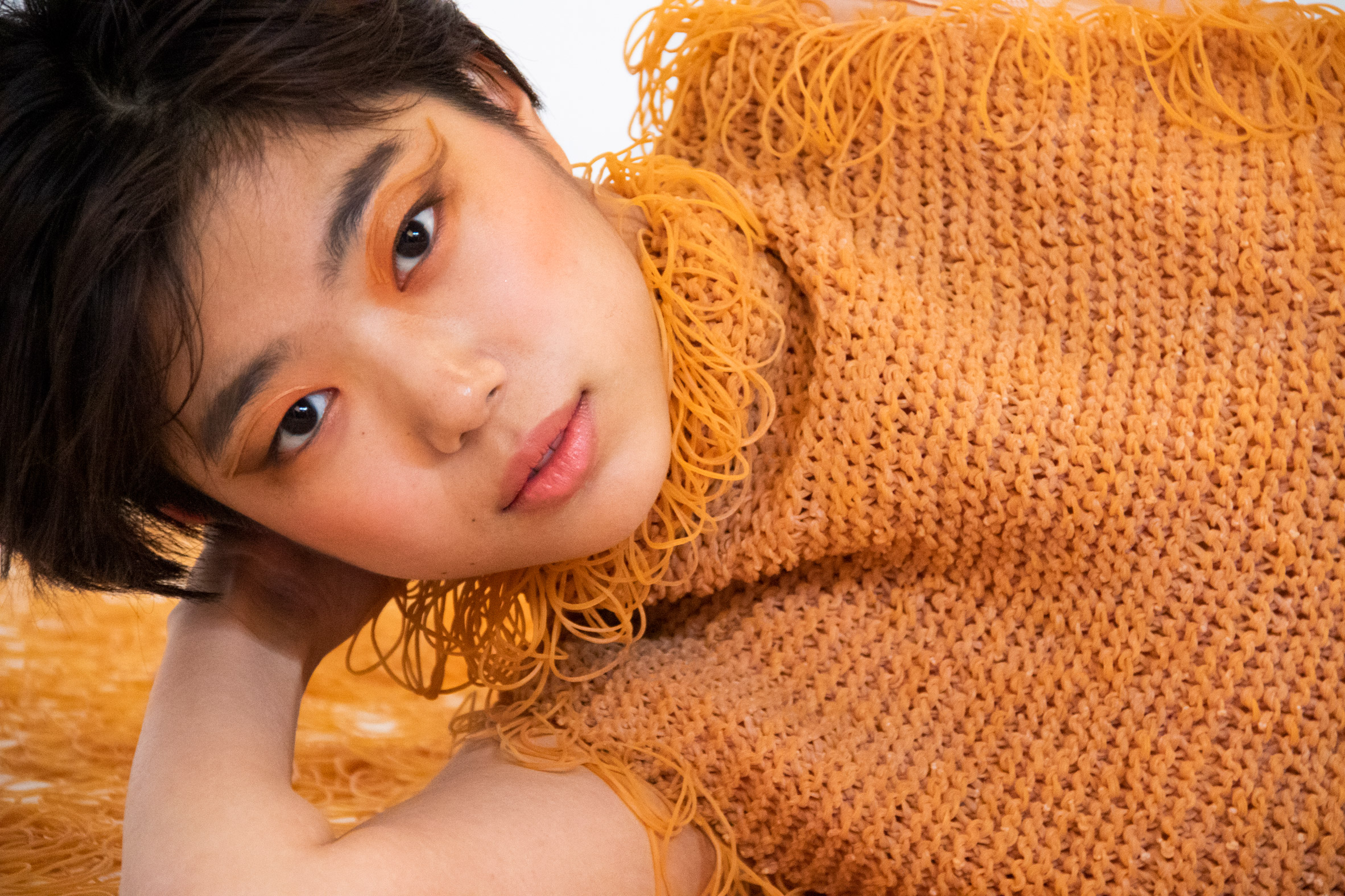 Rie Sakamoto knits rubber bands together like yarn for elastic garments