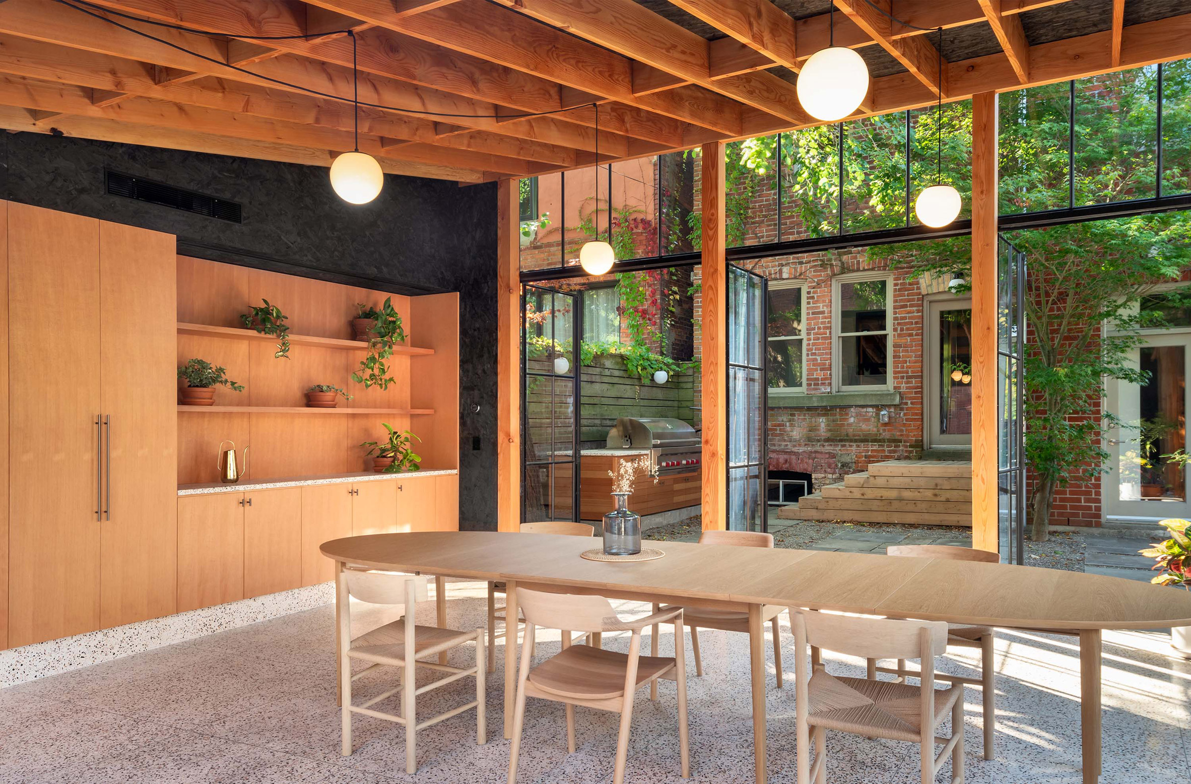 Office Ou turns Toronto garage into workshop, conservatory and