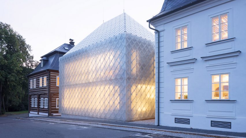 Translucent glass house built alongside historic buildings for Lasvit's Czech Republic HQ