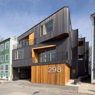 Merge Architects builds dark corrugated steel housing facing Boston harbour