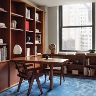 Halleroed creates moody New York office with wood panelled walls