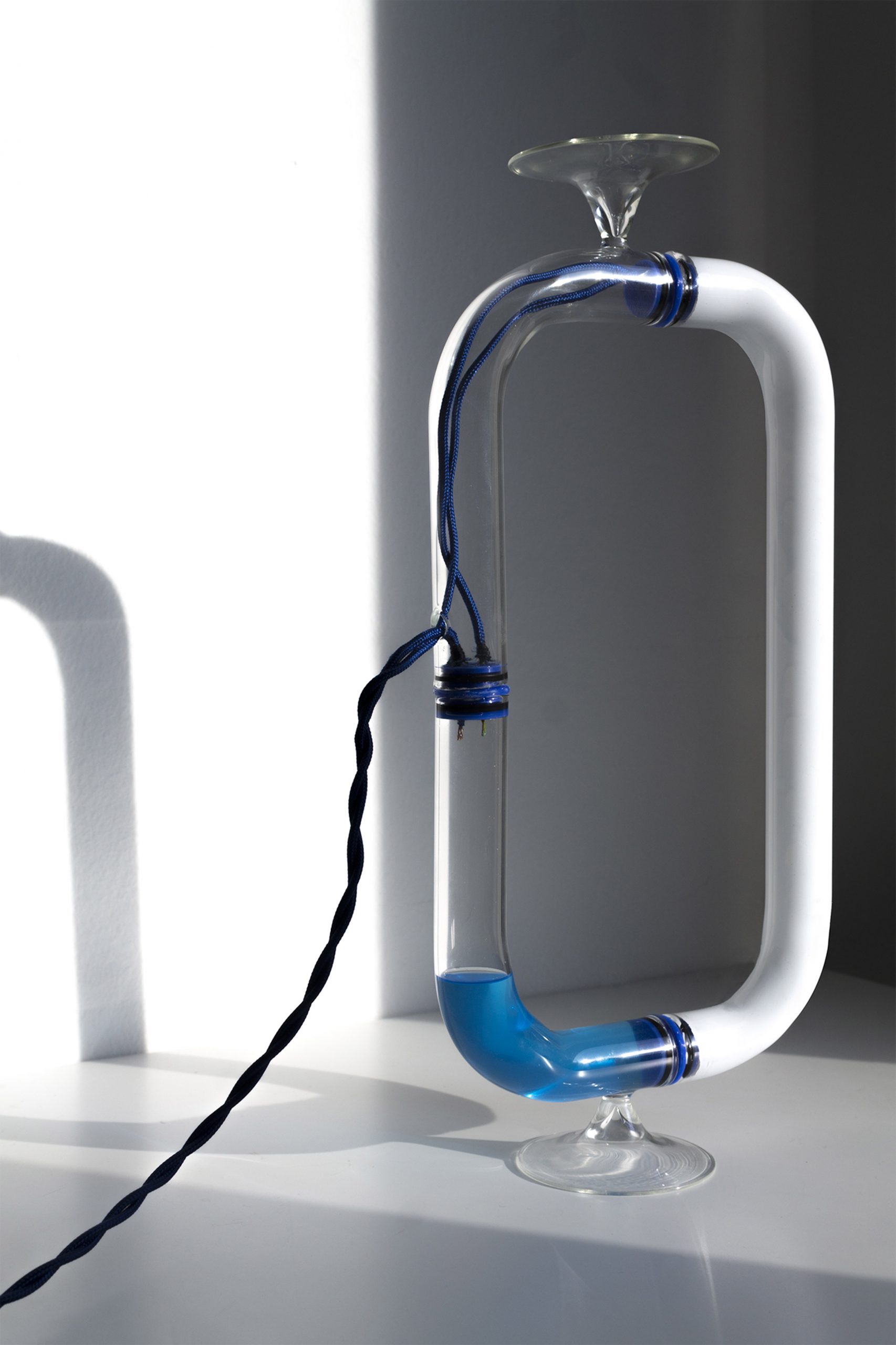Tubular Circuiti Liquidi lamp uses blue liquid to activate light