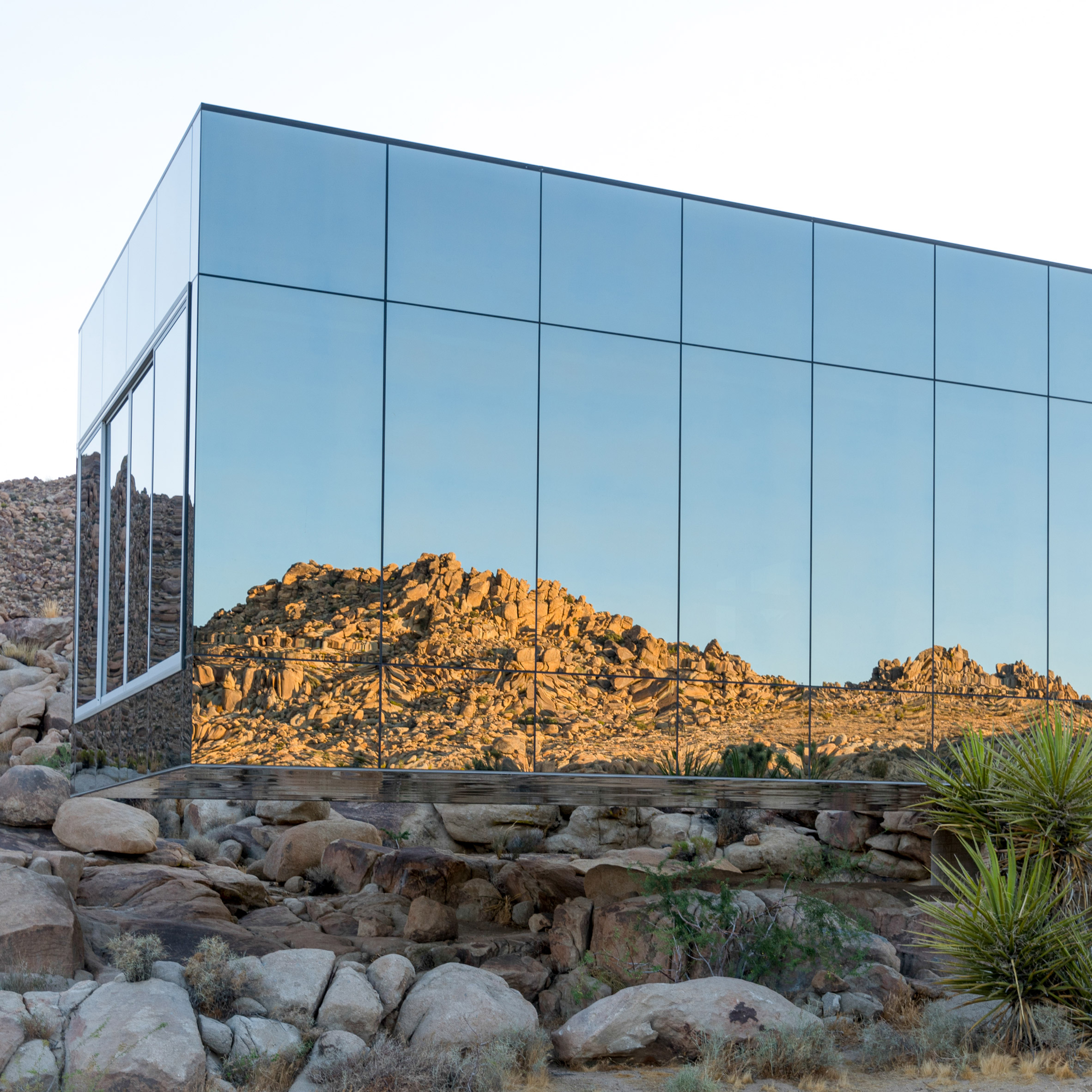 A house with mirrored glass cladding