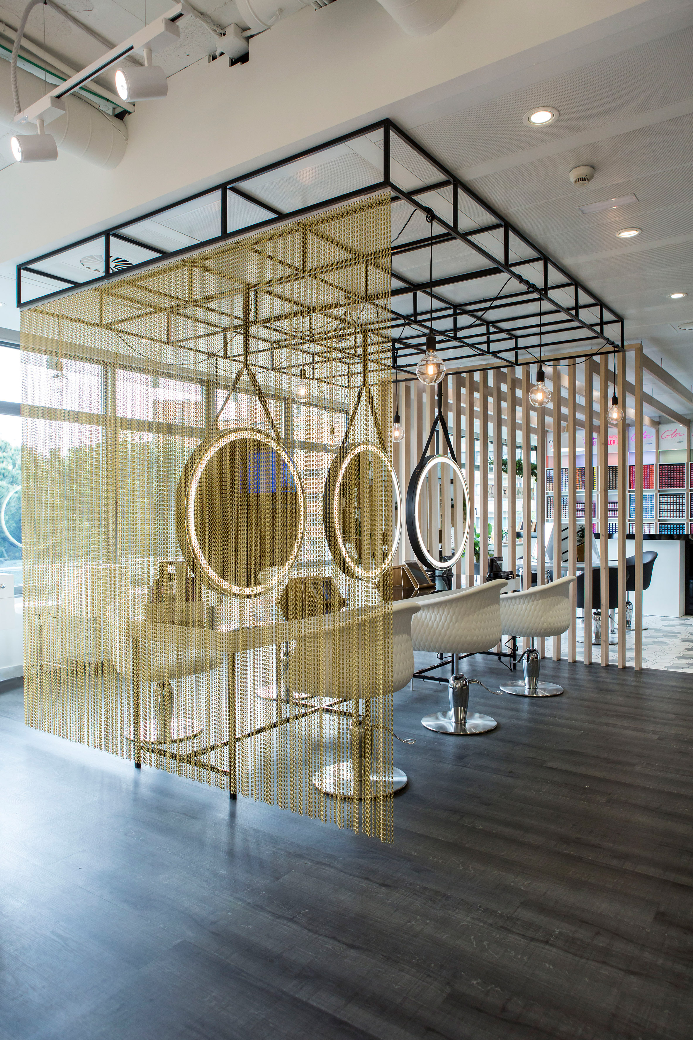 Kriskadecor's chain-link partitions aid social distancing in shared interiors