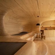 Wooden Cave hotel suite in Greece is made from over 1,000 pieces of hand-cut spruce