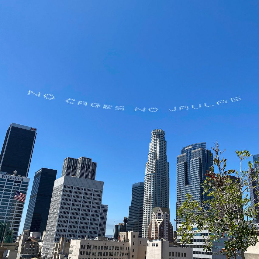 In Plain Sight sky writes "Care not cages" to protest immigration detention